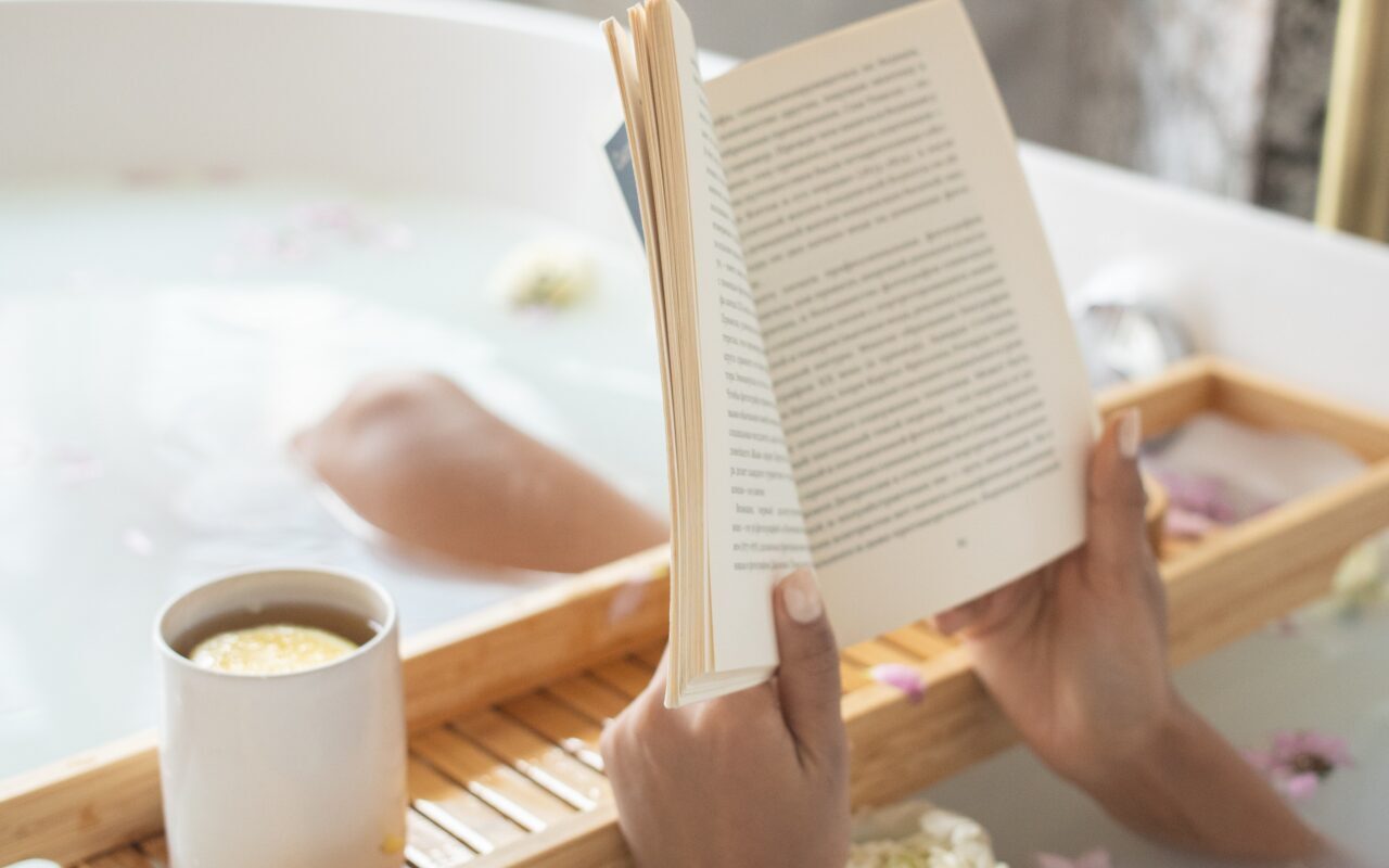 Atomic Habits, reading a book in the bathtub